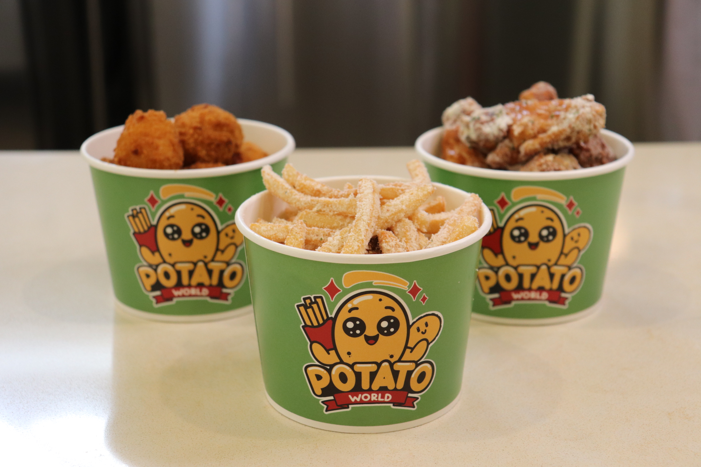 Potato World branded cups with fries and snacks